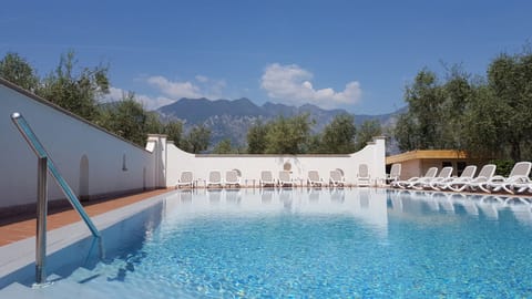 Outdoor pool, open 8:00 AM to 8:00 PM, sun loungers