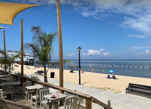 Beach nearby, white sand, beach umbrellas, beach towels