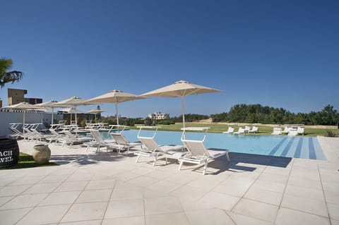 Outdoor pool, pool umbrellas, sun loungers