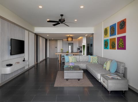 Two Bedroom Pool Suite | Living room | 55-inch LED TV with satellite channels, TV