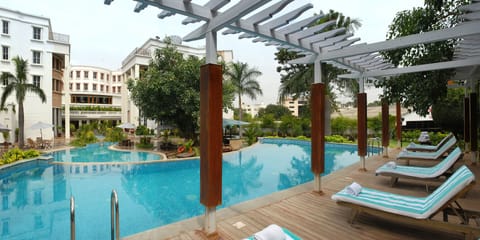 Outdoor pool, pool umbrellas, sun loungers