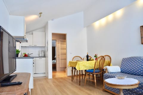 Deluxe Apartment, Terrace and Balcony | Living room | Flat-screen TV