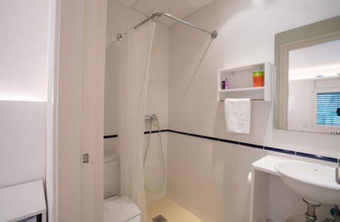 Basic Twin Room, 2 Twin Beds, Refrigerator | Bathroom | Combined shower/tub, free toiletries, hair dryer, towels