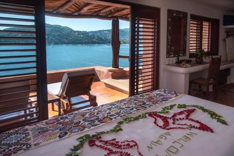 Oceanfront Terrace Suite | Free minibar items, in-room safe, individually decorated