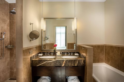 Separate tub and shower, rainfall showerhead, free toiletries