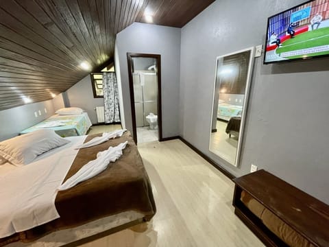 Triple Room | Minibar, desk, cribs/infant beds, free WiFi