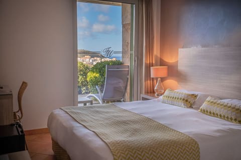 Double or Twin Room, Terrace, Sea View | Minibar, in-room safe, desk, soundproofing