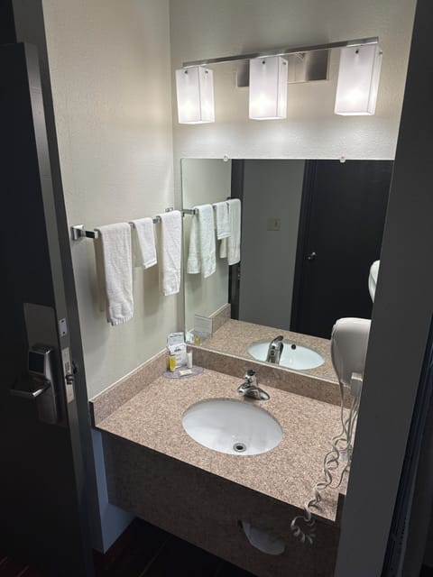 Suite, 1 King Bed, Refrigerator | Bathroom | Combined shower/tub, free toiletries, towels