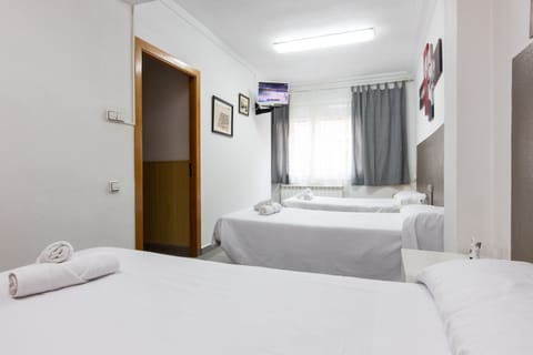 Triple Room, Shared Bathroom | Desk, free WiFi, bed sheets