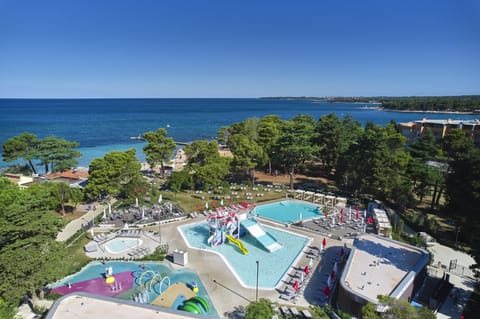 Indoor pool, seasonal outdoor pool, pool umbrellas, sun loungers