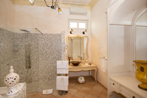 Suite | Bathroom | Rainfall showerhead, hair dryer, bathrobes, slippers