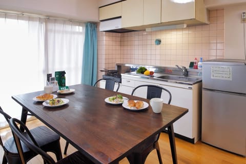 Family Apartment, Non Smoking | Living area | 32-inch flat-screen TV with satellite channels, TV