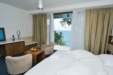 Deluxe Double or Twin Room, Sea View | Minibar, in-room safe, desk, iron/ironing board