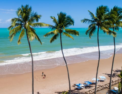 On the beach, white sand, free beach cabanas, sun loungers