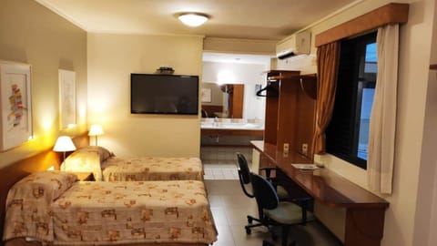 Triple Room | Minibar, desk, blackout drapes, free WiFi