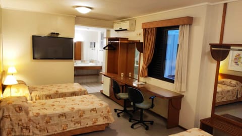 Triple Room | Minibar, desk, blackout drapes, free WiFi