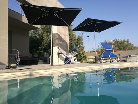 Outdoor pool, an infinity pool, sun loungers