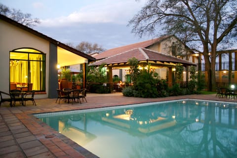 Outdoor pool, pool umbrellas, sun loungers