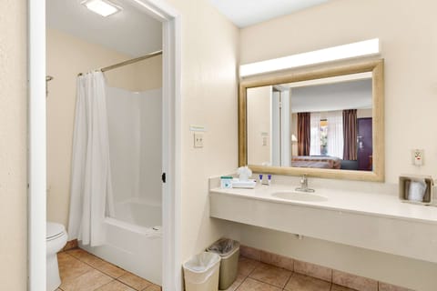 Room, 2 Queen Beds, Non Smoking (max occupancy 4) | Bathroom | Combined shower/tub, free toiletries, hair dryer, towels