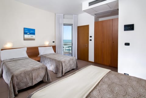 Family Quadruple Room, Sea View | In-room safe, desk, free WiFi, bed sheets