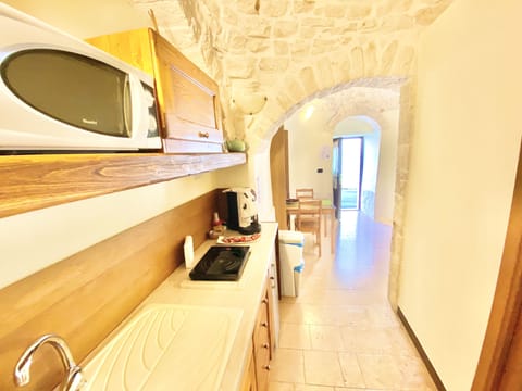 Suite, 2 Bedrooms, Bathtub (Trullo Iris) | Private kitchen | Full-size fridge, stovetop, coffee/tea maker, electric kettle