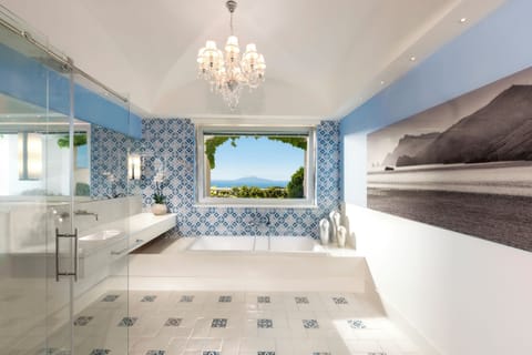 Executive Suite (Capritouch Sea Side) | Bathroom | Separate tub and shower, rainfall showerhead, free toiletries