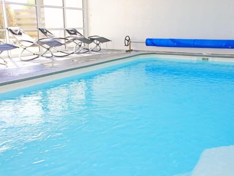 Indoor pool, a heated pool, sun loungers