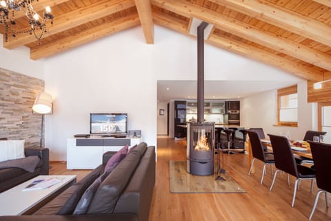 Apartment, 4 Bedrooms (Matterhorn) | Living area | Flat-screen TV, fireplace, DVD player