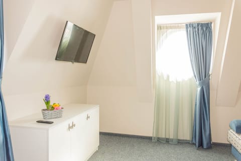 Apartment, 1 Bedroom, Sea View | Minibar, in-room safe, desk, iron/ironing board
