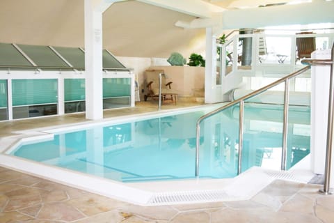 Indoor pool, open 8:00 AM to 9:00 PM, sun loungers