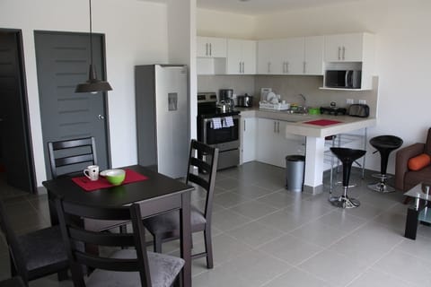 Deluxe Apartment, 2 Bedrooms, Non Smoking | Private kitchen | Full-size fridge, microwave, oven, stovetop