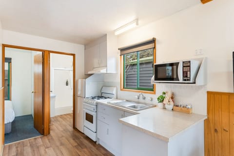 Standard Two Bedroom Cabin, sleeps 6 | Private kitchen | Full-size fridge, microwave, oven, stovetop