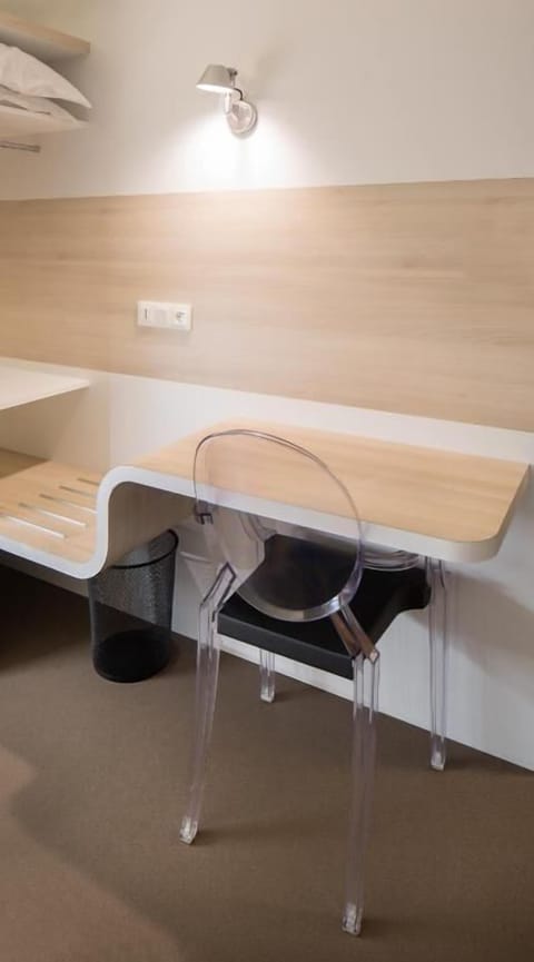 Desk, laptop workspace, blackout drapes, iron/ironing board