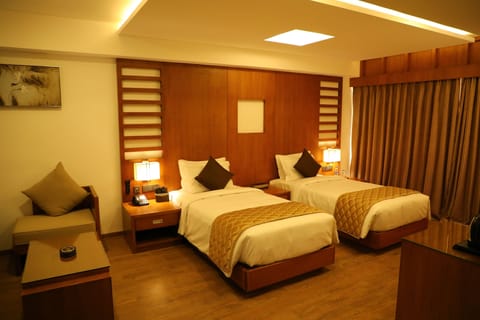 Deluxe Double Room, 1 Bedroom, Smoking | Minibar, in-room safe, soundproofing, iron/ironing board