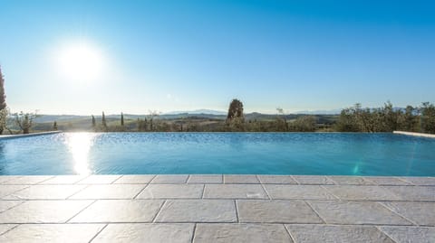 Seasonal outdoor pool, an infinity pool, sun loungers