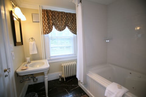 Deluxe King Room, Sitting Area, Private Bathroom,  RM-3 | Bathroom | Combined shower/tub, free toiletries, hair dryer, bathrobes