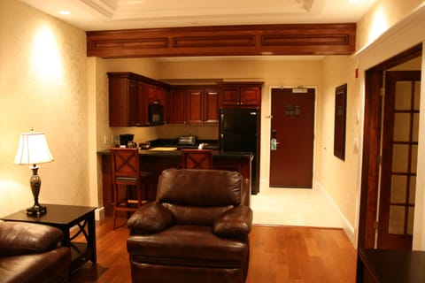 Deluxe Suite, 1 King Bed | Living area | 49-inch flat-screen TV with cable channels, TV, pay movies