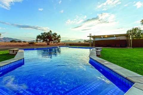 Outdoor pool, pool umbrellas, sun loungers