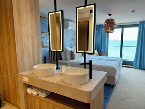 Shower, rainfall showerhead, hair dryer, towels