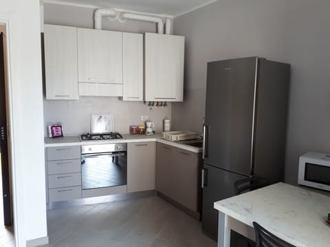 Apartment, 1 Bedroom | Private kitchenette | Full-size fridge, coffee/tea maker, electric kettle