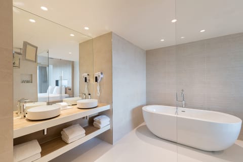 Suite, 1 King Bed | Bathroom | Free toiletries, hair dryer, bathrobes, slippers