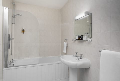 Combined shower/tub, hair dryer, towels, soap