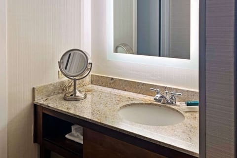 Suite, 1 King Bed | Bathroom | Combined shower/tub, hair dryer, towels, soap