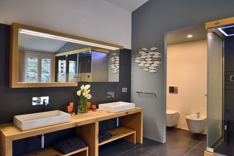 Luxury Suite, 1 King Bed, Jetted Tub | Bathroom | Shower, jetted tub, rainfall showerhead, designer toiletries