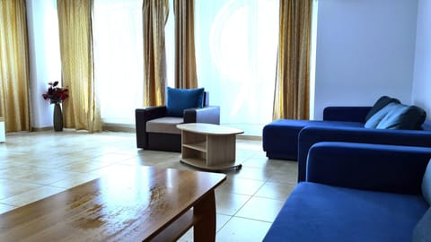 Apartment, 2 Bedrooms | Living area | Flat-screen TV