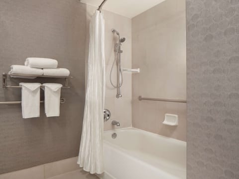 Combined shower/tub, designer toiletries, hair dryer, towels