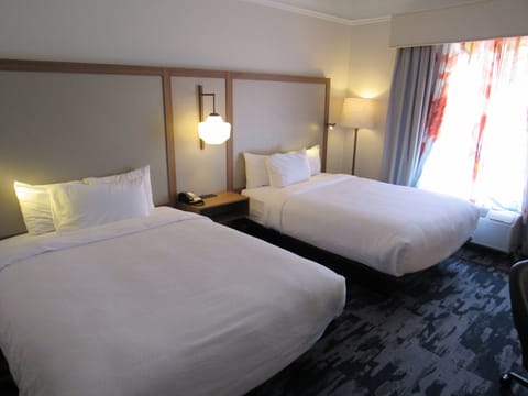 Room, 2 Queen Beds | Desk, blackout drapes, iron/ironing board, free cribs/infant beds