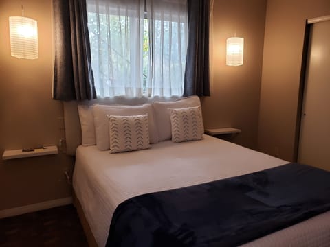 Deluxe Room, 1 Queen Bed | Individually furnished, laptop workspace, blackout drapes, free WiFi