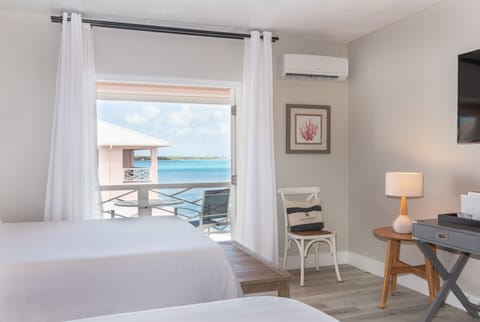 Room, 2 Queen Beds, Balcony, Partial Ocean View | In-room safe, soundproofing, iron/ironing board, bed sheets