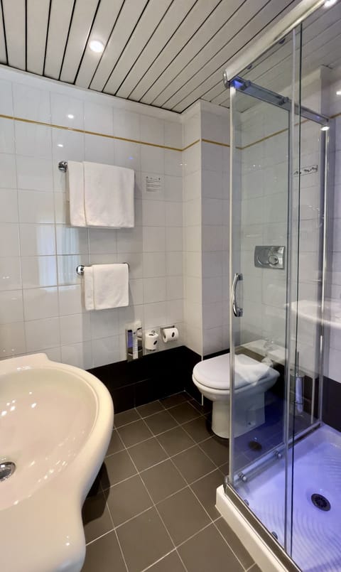 Comfort Room | Bathroom | Shower, rainfall showerhead, designer toiletries, hair dryer